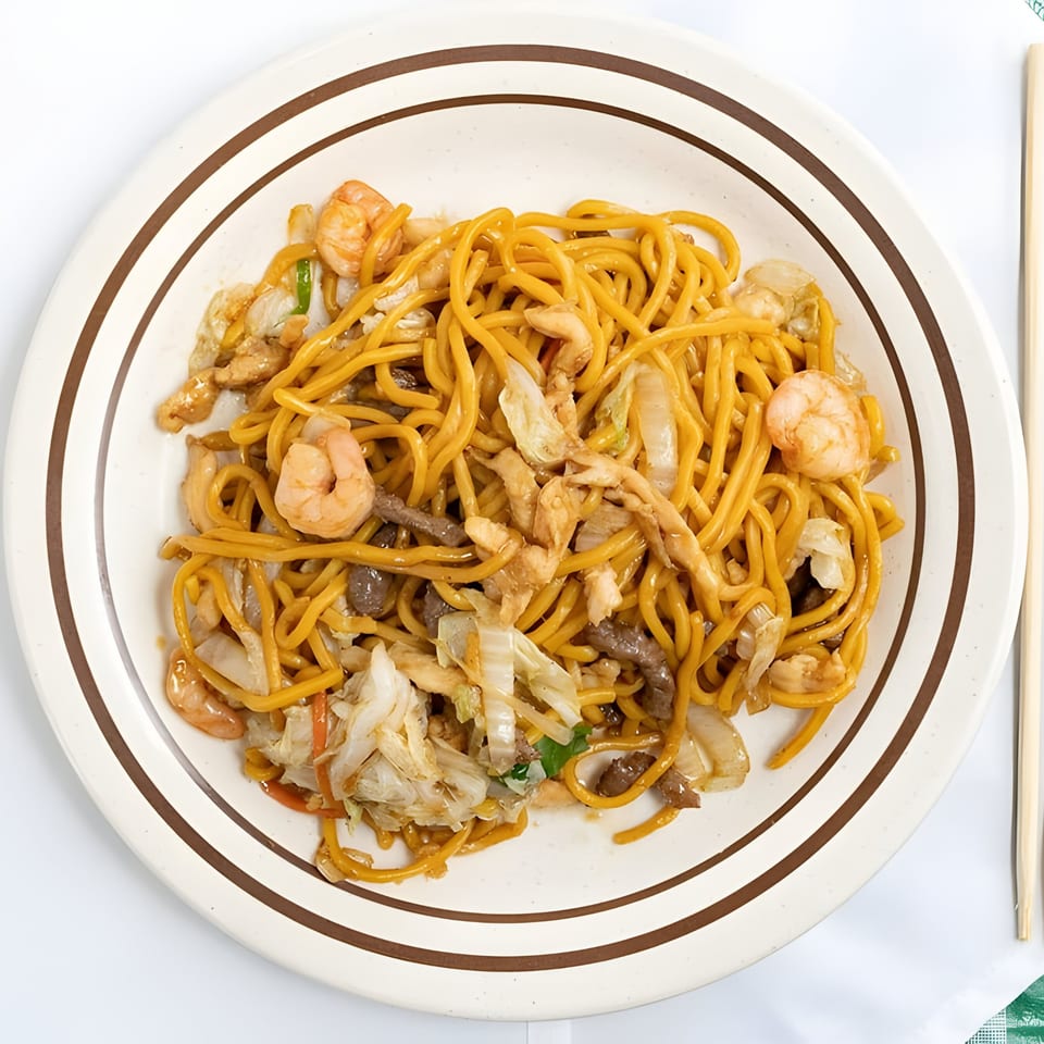 Mandarin Cafe's House Special Lo Mein with shrimp, chicken, beef, and vegetables on a white plate.