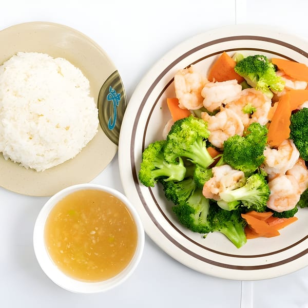 Mandarin Cafe's shrimp with broccoli and carrots, served with white rice and a side of sauce.